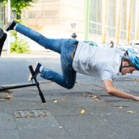 Man Falling From E-Scooter