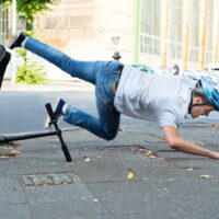 Man Falling From E-Scooter Man Falling From E-Scooter