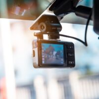 Car video camera attached to the windshield to record driving and prevent danger from driving Car video camera attached to the windshield to record driving and prevent danger from driving