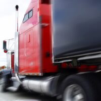 Danger on the road, a huge truck in city traffic Danger on the road, a huge truck in city traffic